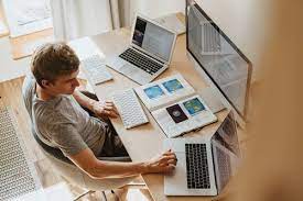 man working on computer at home